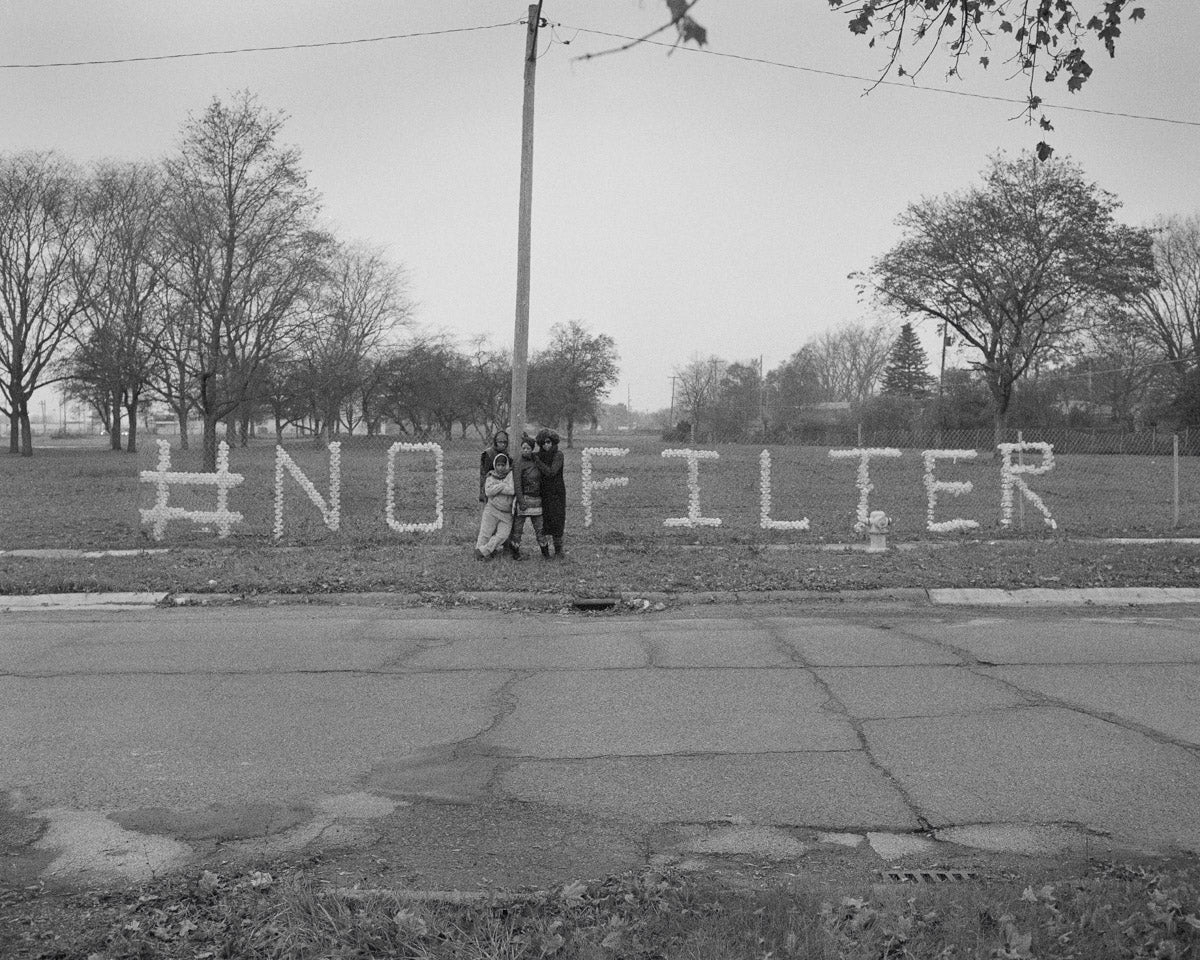 A Message in Nestlé Water Bottles from Shea Cobb, Amber Hasan, Macana Roxie, and LaToya Ruby Frazier at Sussex Drive and West Pierson Road, Flint, Michigan